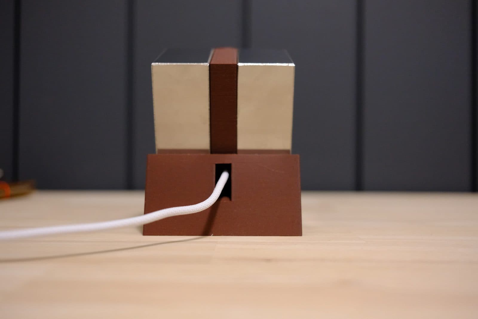 Back of the dock showing the two 1-2-3 blocks side by side and the MagSafe cable exiting the slot in the base