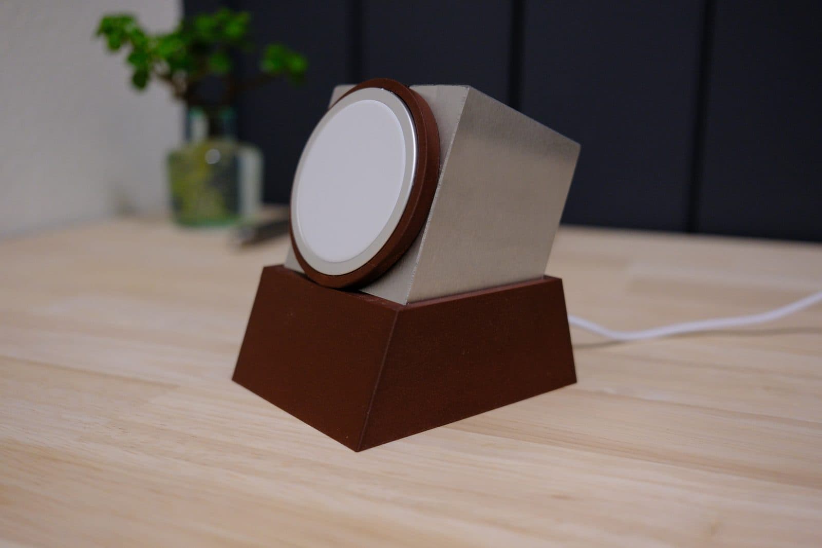 Dock Block printed in brown, with a steel 1-2-3 block and an Apple MagSafe charger set into the printed ring
